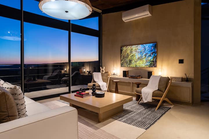 Living area with the valley framed floor to ceiling