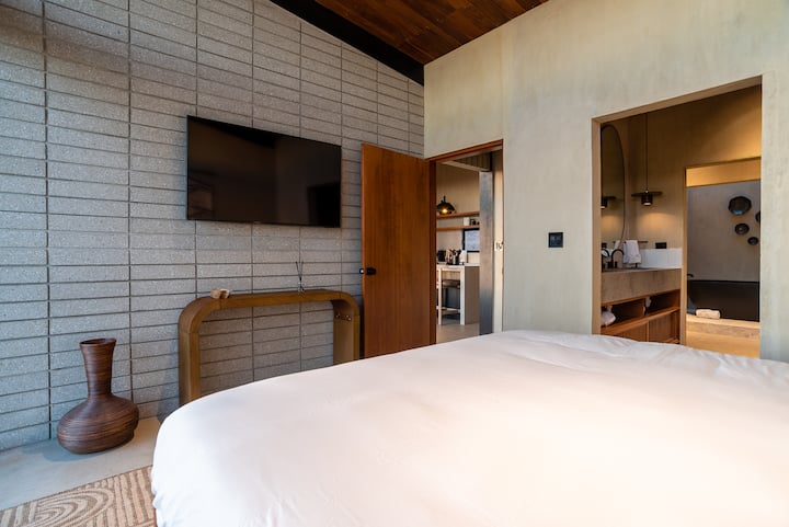 Clean lines and white linen in a guest room