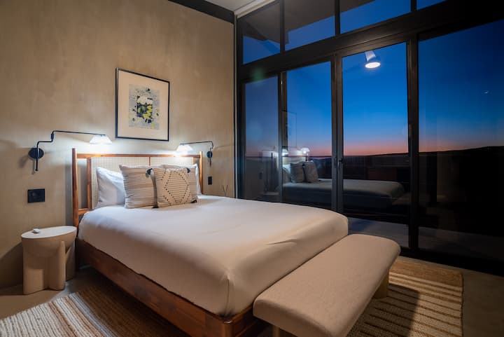 A twin room framed in warm wood