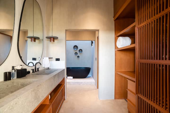 Sculpted basins and a soaking tub