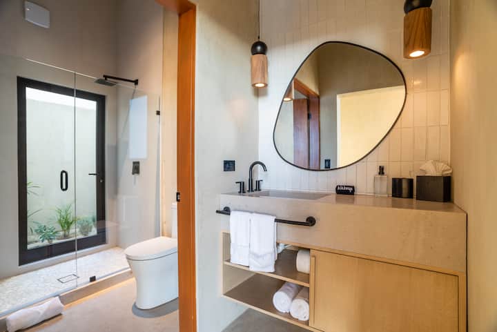 A walk-in shower finished in warm plaster