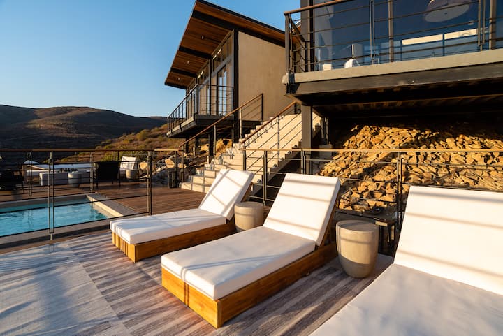 Loungers on the deck as the sun drops