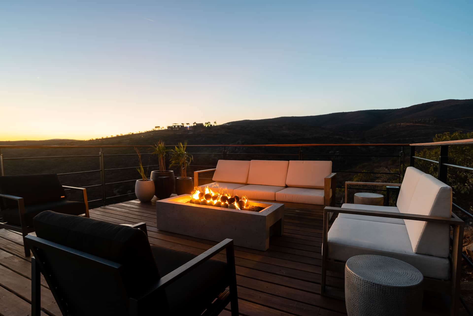 The fire pit lounge under a darkening sky