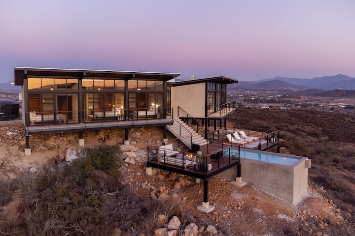The house on the hill under a violet sky